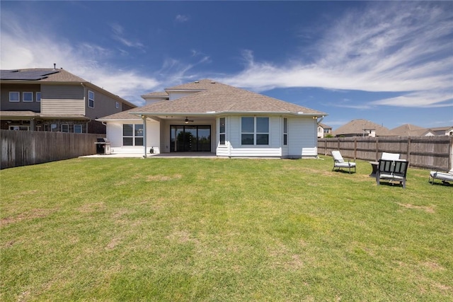 5213 Fresno Ave, Pflugerville, TX 78660 - rear view of property with a ceiling fan, a patio, a fenced backyard, and a shingled roof