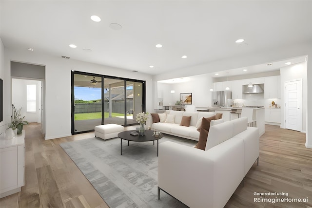 5213 Fresno Ave, Pflugerville, TX 78660 - living area featuring light wood-style floors and recessed lighting