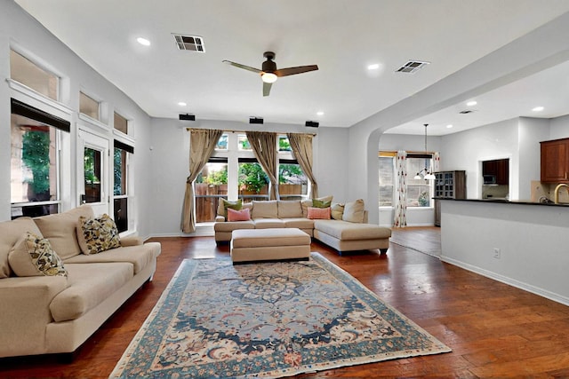 16525 Broadbay Dr, Austin, TX 78717 - living area with a ceiling fan, arched walkways, dark wood finished floors, recessed lighting, and baseboards
