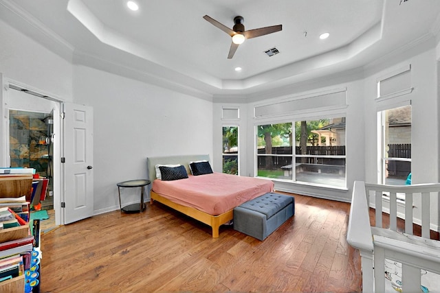 16525 Broadbay Dr, Austin, TX 78717 - bedroom with a raised ceiling, hardwood / wood-style flooring, and recessed lighting