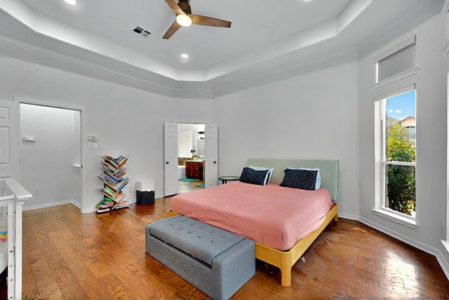 16525 Broadbay Dr, Austin, TX 78717 - bedroom with a raised ceiling, wood finished floors, recessed lighting, baseboards, and ceiling fan