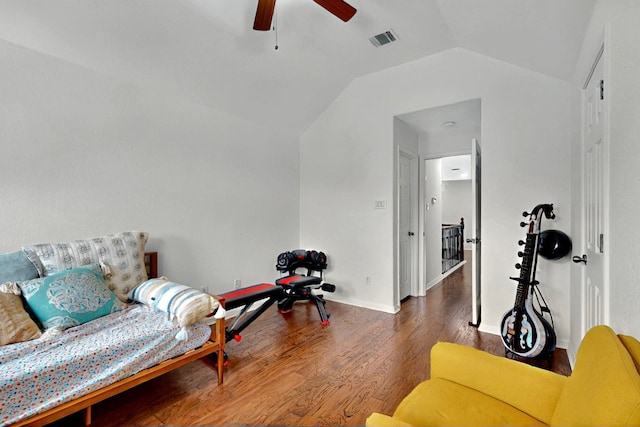 living area with lofted ceiling, ceiling fan, wood finished floors, and baseboards