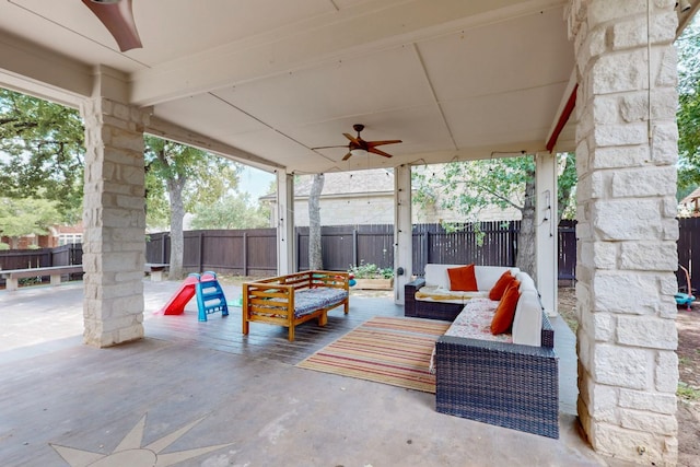 view of patio / terrace with ceiling fan, an outdoor living space, and a fenced backyard
