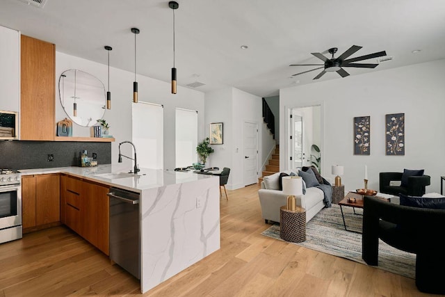 1140 Northwestern Ave Unit 2, Austin, TX 78702 - kitchen featuring open floor plan, stainless steel appliances, and light wood-type flooring