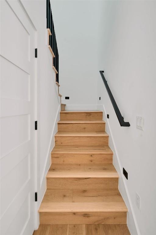1140 Northwestern Ave Unit 2, Austin, TX 78702 - stairs with wood finished floors and baseboards
