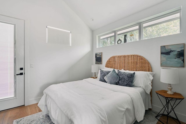 1140 Northwestern Ave Unit 2, Austin, TX 78702 - bedroom featuring lofted ceiling and wood finished floors