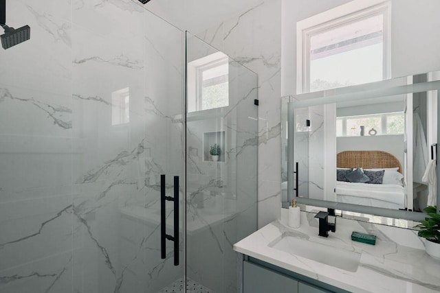 1140 Northwestern Ave Unit 2, Austin, TX 78702 - ensuite bathroom featuring healthy amount of natural light, a marble finish shower, and vanity