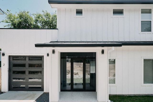 1140 Northwestern Ave Unit 2, Austin, TX 78702 - view of exterior entry featuring a standing seam roof, a metal roof, and a garage