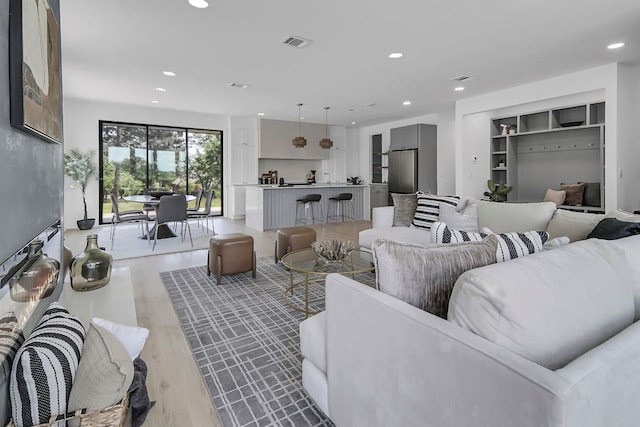 214 Ulupau Cir, Bastrop, TX 78602 - living room featuring recessed lighting and light wood-style flooring