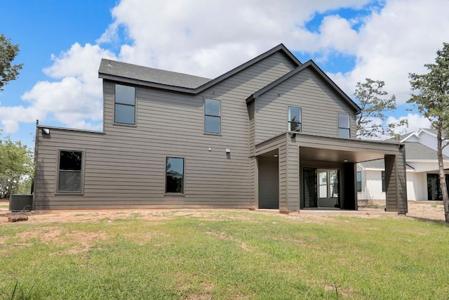 214 Ulupau Cir, Bastrop, TX 78602 - back of property with a lawn