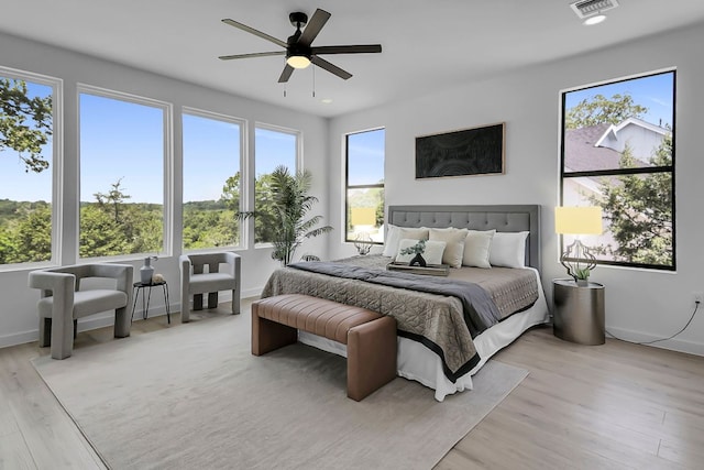 214 Ulupau Cir, Bastrop, TX 78602 - bedroom featuring light wood-style flooring and ceiling fan