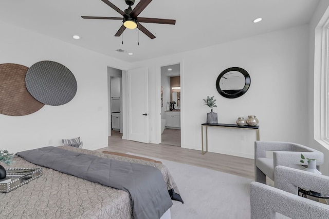 214 Ulupau Cir, Bastrop, TX 78602 - bedroom with wood finished floors, recessed lighting, ensuite bath, and ceiling fan