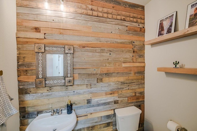 1812 Morts Pl, Manchaca, TX 78652 - half bathroom with wooden walls and toilet