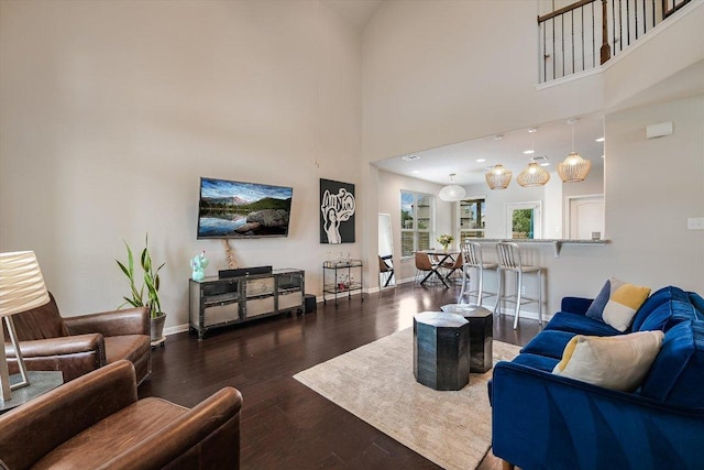 1812 Morts Pl, Manchaca, TX 78652 - living area featuring wood finished floors, baseboards, and a high ceiling