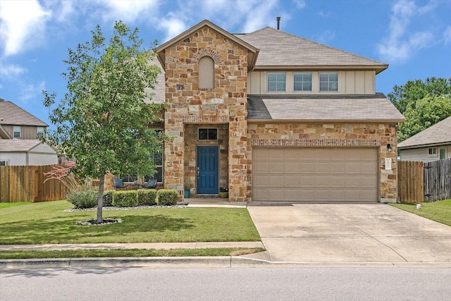 1812 Morts Pl, Manchaca, TX 78652 - view of front of house with stone siding, driveway, an attached garage, and a shingled roof