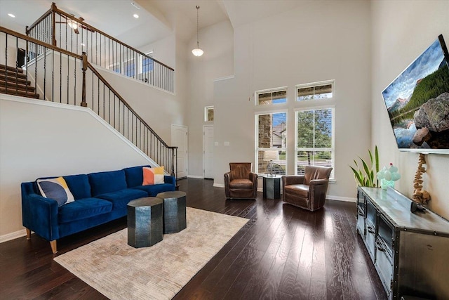 1812 Morts Pl, Manchaca, TX 78652 - living area featuring stairway, dark wood-type flooring, a towering ceiling, baseboards, and recessed lighting