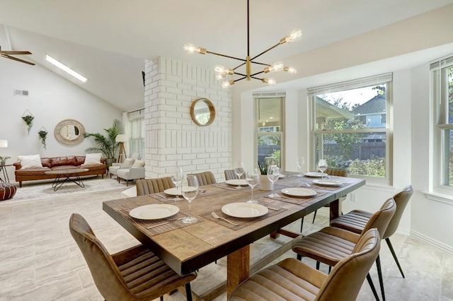 dining space with vaulted ceiling and a chandelier
