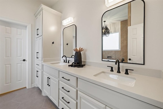 bathroom with double vanity and tile patterned flooring