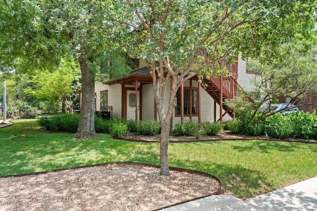 4015 Speedway Unit 1, Austin, TX 78751 - view of front facade featuring a front yard, stairway, and a wooden deck