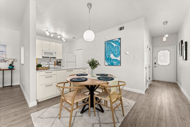4015 Speedway Unit 1, Austin, TX 78751 - dining space with light wood-type flooring and baseboards