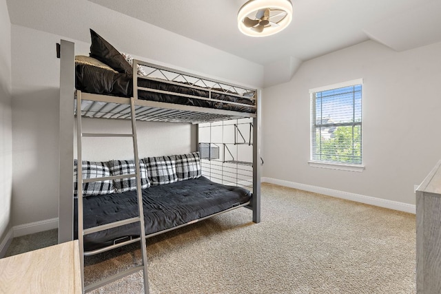 carpeted bedroom featuring baseboards