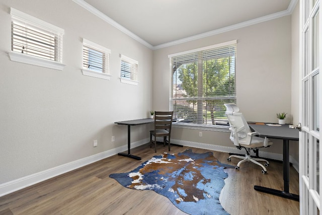 home office with wood finished floors, crown molding, and baseboards
