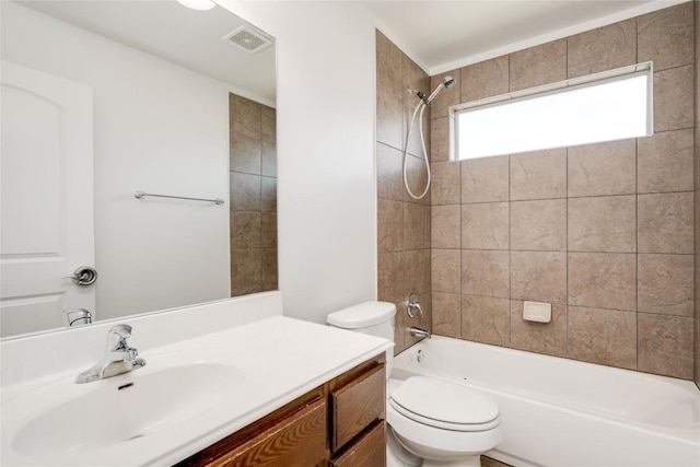 full bathroom featuring toilet, washtub / shower combination, and vanity