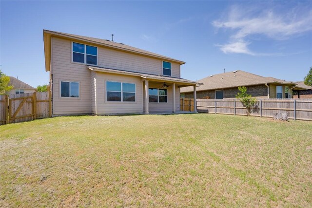back of property featuring a ceiling fan