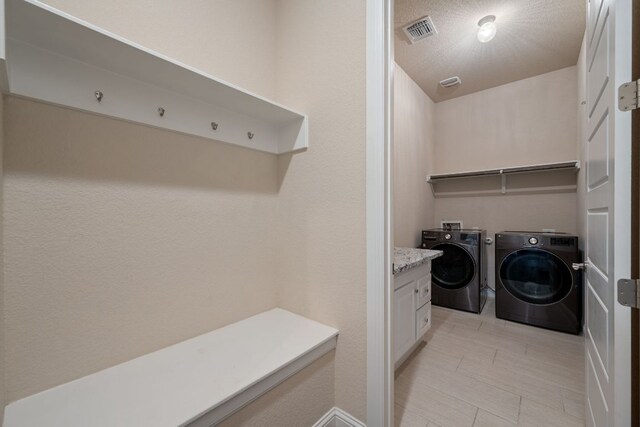 laundry area with washer and dryer