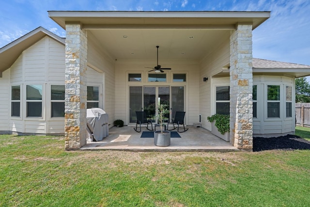 back of property with a patio and a ceiling fan