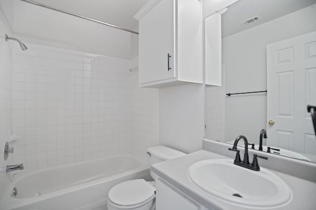 bathroom featuring toilet,  shower combination, and vanity