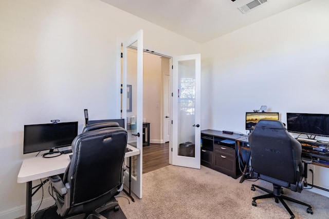 home office with french doors, light carpet, and baseboards
