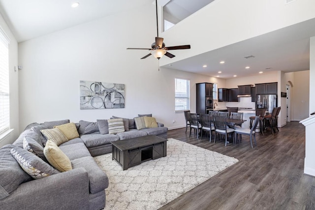 3805 Eland Dr, Pflugerville, TX 78660 - living room featuring dark wood-style flooring, ceiling fan, baseboards, recessed lighting, and a high ceiling