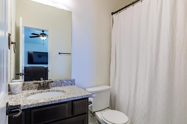 3805 Eland Dr, Pflugerville, TX 78660 - full bath featuring toilet, vanity, ceiling fan, and a shower with curtain