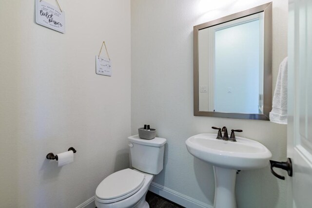 3805 Eland Dr, Pflugerville, TX 78660 - half bathroom featuring toilet and baseboards