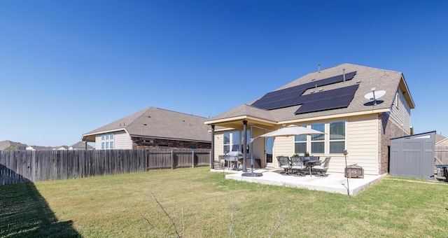 3805 Eland Dr, Pflugerville, TX 78660 - rear view of property with a patio area and solar panels