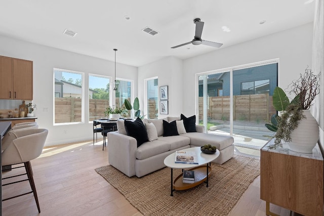 6406 Cannonleague Dr Unit 1, Austin, TX 78745 - living room with light wood-style flooring, ceiling fan, baseboards, and recessed lighting