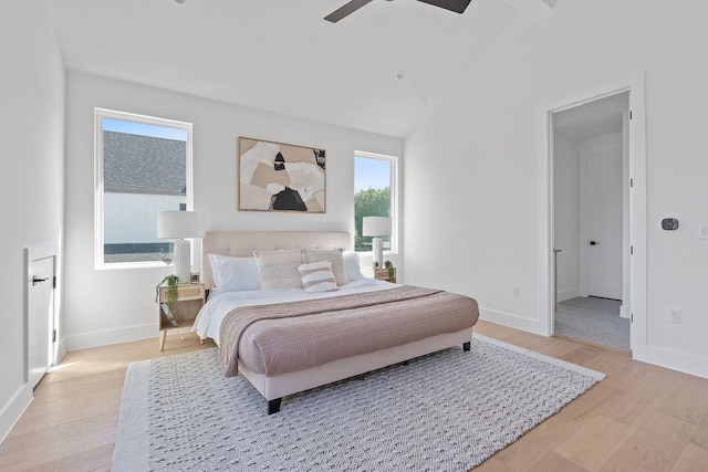 6406 Cannonleague Dr Unit 1, Austin, TX 78745 - bedroom with light wood finished floors, baseboards, a ceiling fan, and lofted ceiling