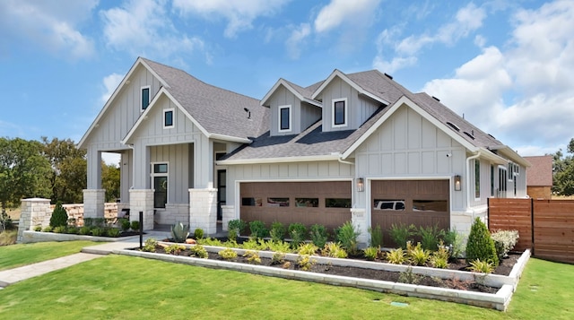 1026 Painted Horse Dr, Georgetown, TX 78633 - view of front of home with roof with shingles, board and batten siding, a garage, and stone siding