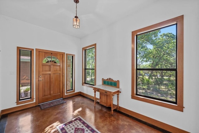16704 Post Oak Gln, Austin, TX 78737 - foyer entrance featuring finished concrete floors and baseboards