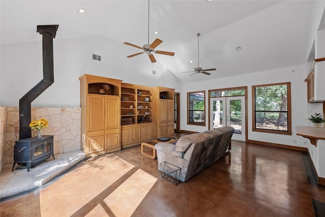 16704 Post Oak Gln, Austin, TX 78737 - living area with a wood stove, high vaulted ceiling, recessed lighting, ceiling fan, and finished concrete flooring