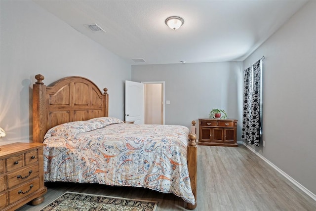446 Thunder Valley Trl, Georgetown, TX 78626 - bedroom with wood finished floors and baseboards