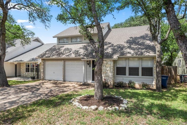 view of front of house with stone siding, roof with shingles, driveway, and an attached garage