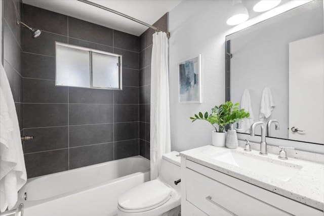 bathroom featuring shower / tub combo with curtain, toilet, and vanity