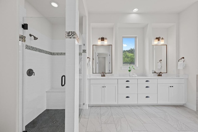 full bath featuring a stall shower, double vanity, recessed lighting, and marble look tile flooring