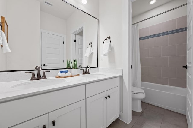 156 Sea Hero Pl, Austin, TX 78737 - full bathroom featuring double vanity, tile patterned floors, shower / bath combo with shower curtain, and toilet