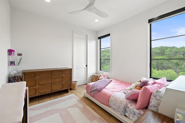 903 Alexia Ln, Austin, TX 78746 - bedroom featuring wood finished floors, recessed lighting, and ceiling fan