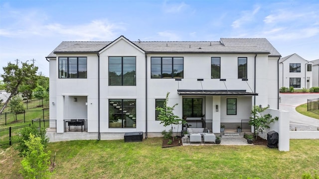 903 Alexia Ln, Austin, TX 78746 - back of house featuring stucco siding and a patio area
