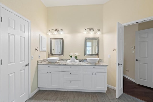 17112 Crescent Heights Trl, Austin, TX 78717 - full bathroom featuring double vanity and wood finished floors