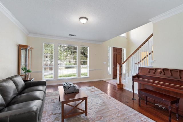 17112 Crescent Heights Trl, Austin, TX 78717 - living room with stairway, wood finished floors, crown molding, and baseboards